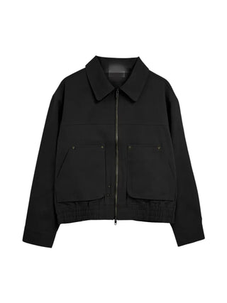 Black loose-fit jacket that accentuates a delicate silhouette