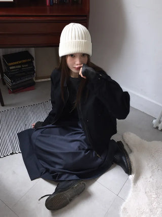 Black loose-fit jacket that accentuates a delicate silhouette