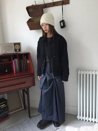 Black loose-fit jacket that accentuates a delicate silhouette