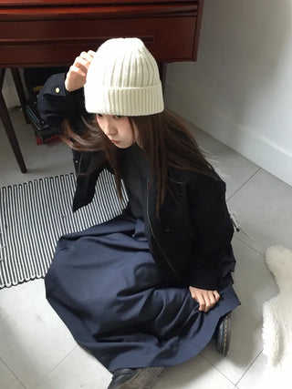 Black loose-fit jacket that accentuates a delicate silhouette