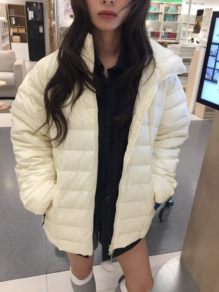 Lightweight, warm  Loose-fit lightweight padded jacket