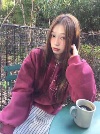 Red hoodie that brightens up your face with floral embroidery details