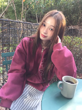 Red hoodie that brightens up your face with floral embroidery details