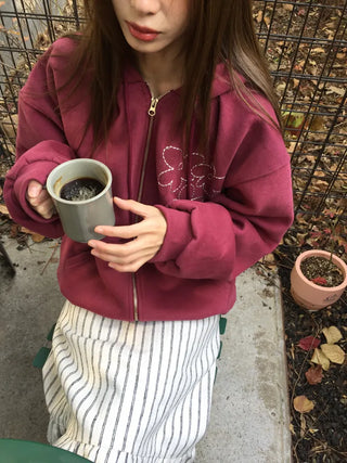 Red hoodie that brightens up your face with floral embroidery details