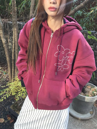 Red hoodie that brightens up your face with floral embroidery details