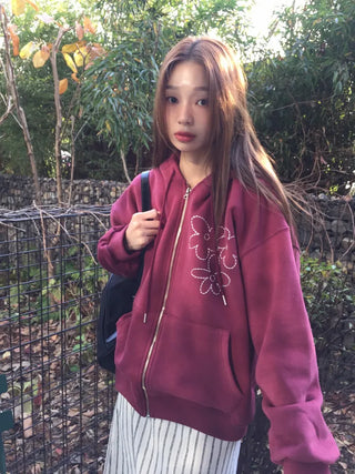 Red hoodie that brightens up your face with floral embroidery details
