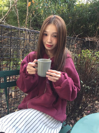 Red hoodie that brightens up your face with floral embroidery details