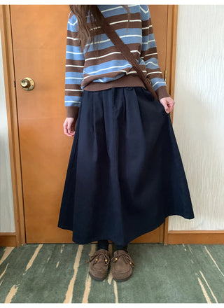 pleated denim skirt