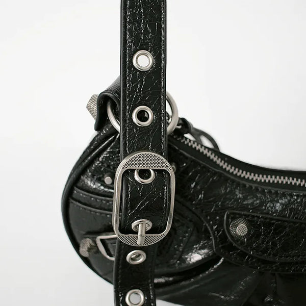 Natural cowhide belted eyelet motor bag