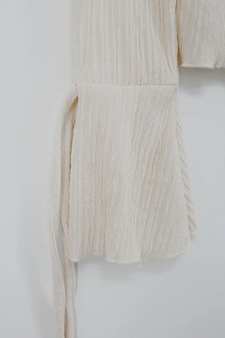 Blouse with corset eyelet straps and pleated blouse