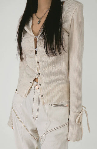 Blouse with corset eyelet straps and pleated blouse