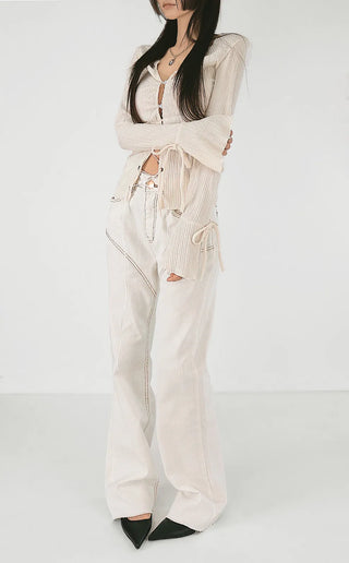 Blouse with corset eyelet straps and pleated blouse