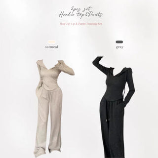 Semi zip up hooded training two piece set with slim fit top and wide loose fit training pants.