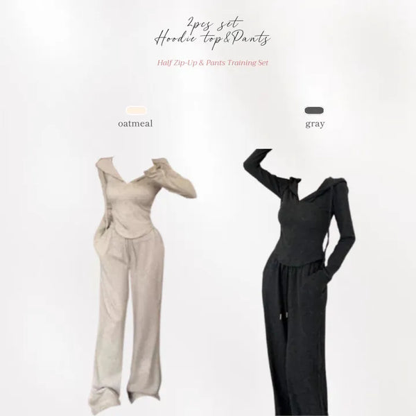 Semi zip up hooded training two piece set with slim fit top and wide loose fit training pants.