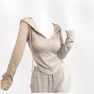 Semi zip up hooded training two piece set with slim fit top and wide loose fit training pants.