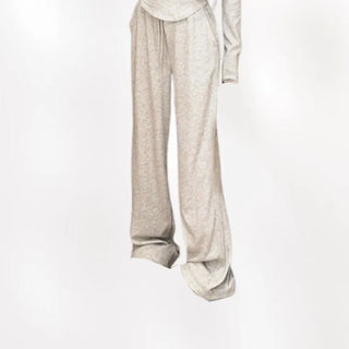 Semi zip up hooded training two piece set with slim fit top and wide loose fit training pants.