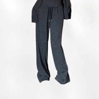 Semi zip up hooded training two piece set with slim fit top and wide loose fit training pants.