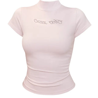 Pink short sleeved T shirt with spangle lettering