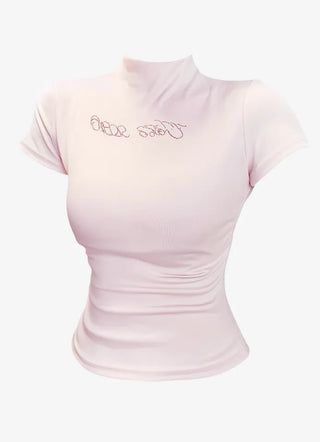 Pink short sleeved T shirt with spangle lettering