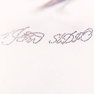 Pink short sleeved T shirt with spangle lettering