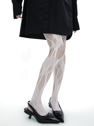 Ripped fishnet pantyhose
