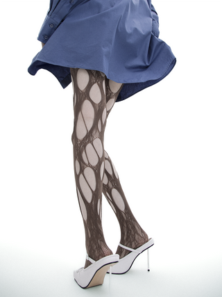 Ripped fishnet pantyhose