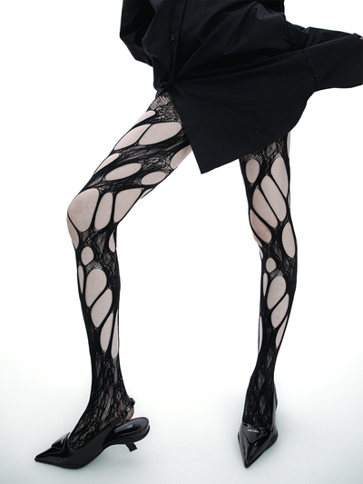 Ripped fishnet pantyhose