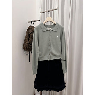 brass buckle sweater