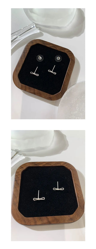 bow stud earrings