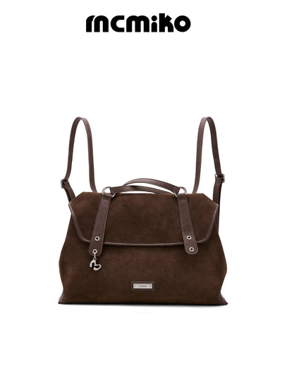 suede flip backpack