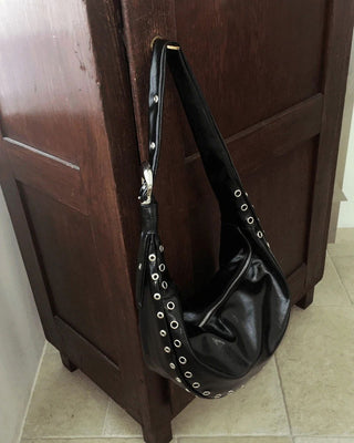 Retained eyelet leather cross shoulder bag