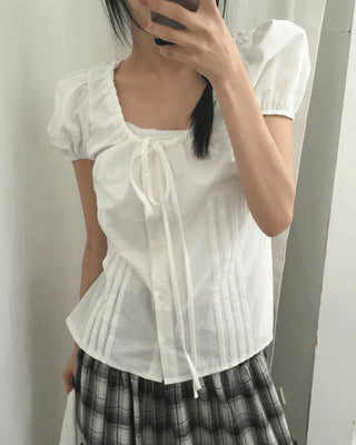 Roche pin tuck ribbon back strap button blouse