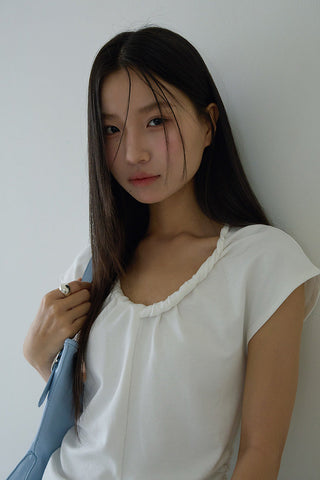 pleated sleeveless top