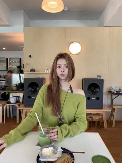green diagonal sweater