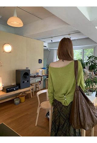 green diagonal sweater