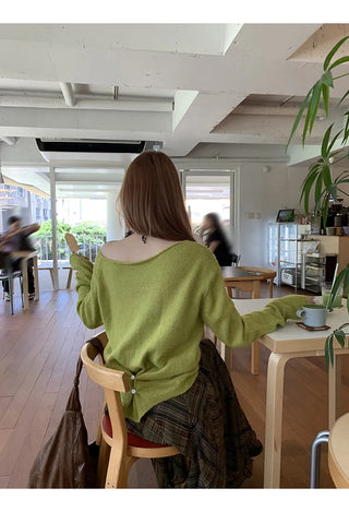 green diagonal sweater