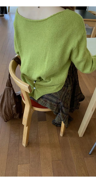 green diagonal sweater