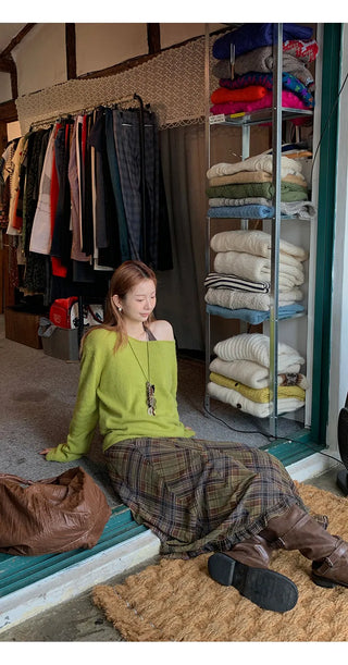 green diagonal sweater