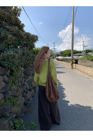 green diagonal sweater