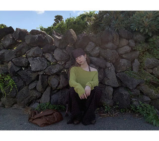 green diagonal sweater