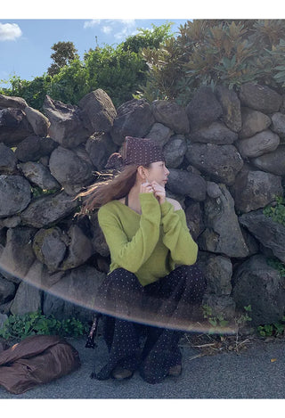 green diagonal sweater