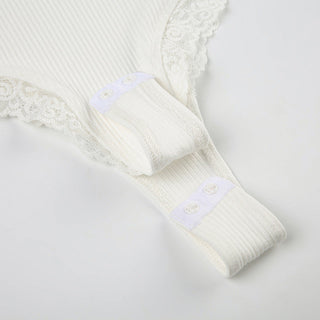 V -neck shows a thin suspender vest
