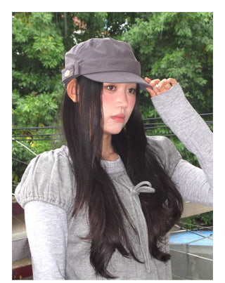 black peaked cap