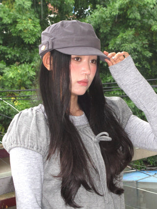 black peaked cap