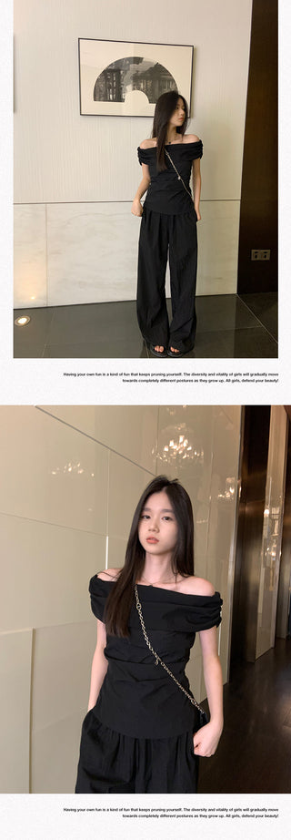 black off-shoulder suit