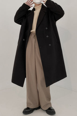 Double-breasted mid-length woolen coat