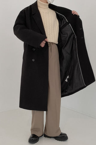 Double-breasted mid-length woolen coat