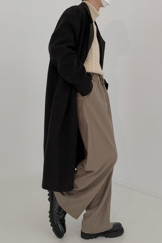 Double-breasted mid-length woolen coat